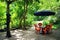 Recreational place in Minca village - a table from an wooden spool and four chairs under a sun umbrella.