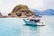 Recreational speed boat anchoring near small islands. Beautiful landscape, seascape in summer sunny day. Perfect getaway.