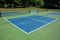 Recreational sport of pickleball court in Michigan, USA looking at an empty blue and green new court at a outdoor park