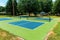 Recreational sport of pickleball court in Michigan, USA looking at an empty blue and green new court at a outdoor park