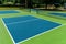 Recreational sport of pickleball court in Michigan, USA looking at an empty blue and green new court at a outdoor park