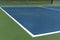 Recreational sport of pickleball court in Michigan, USA looking at an empty blue and green new court at a outdoor park. Ground