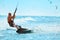Recreational Sports. Man Kiteboarding In Sea Water. Extreme Sport Action