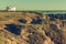 Recreational Vehicle Alone on Hilly Ocean Coast