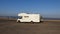 Recreational vehicle in the middle of beach empty parking lot