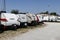 Recreational vehicles lined up for sale. Colorful RV brands are available at a motorhome dealership