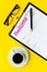 Recruitment. Select employees. Resume near coffee, glasses on yellow background top view