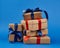 Rectangle box wrapped in brown kraft paper and tied with a silk blue and red ribbon