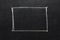 Rectangle drawn with chalk on blackboard