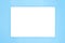 A rectangle empty white plate isolated on the light blue background