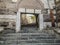 Rectangular gate in a stone wall in the ancient Ankara Castle in capital of Turkey. Stone steps and a wall of multi-colored huge