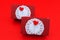 Rectangular gift box with circular white paper towel and red heart shape