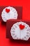 Rectangular gift box with circular white paper towel and red heart shape. Vertical shot