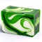 A rectangular isolated bar of handmade soap featuring green, black and white swirls