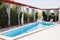 A rectangular long pool in the villa.