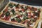 Rectangular shape and thick hand made romana`s pizza traditional italian pizza margherita closeup
