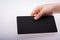 Rectangular shaped black notice board in hand