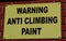 Rectangular sign warning of anti climbing paint Widnes April 2019