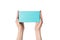 Rectangular turquoise box in female hands. Top view. Isolate