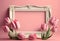 Rectangular white wooden picture frame with empty space for text and framed with pink tulips, AI generative content.