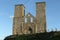 Reculver towers a roman saxon shore fort and remains of a 12th century church undercut by coastal erosion.