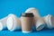 Recycle Brown Paper Coffee Cup Mockup, Take Away Cup for Drinks Isolated on Blue Background with Spilled White Paper Coffee Cups,