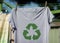 Recycle clothes icon on t shirt with 100% Recycled text, concept illustration reuse, recycle clothes and textiles to reduce waste