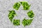 Recycle for green nature, symbol by fresh grass leaves.