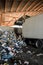 Recycle plant. truck unloading huge amounts of garbage, recycle