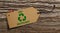 Recycle tag on bark tree