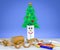 Recycle toilet roll tubes, decorated and reused to make fun Christmas tree decoration with smiling face, homemade quirky craft fun