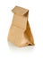 Recycled brown paper doggy bag over white background