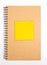 Recycled Paper Notebook Front Cover With Yellow Sticky Note.