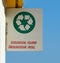 Recycling area sign, ecological island, hanging on a wall.