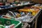 Recycling bin filled with assorted plastic bottles and containers promoting environmental responsibility