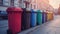 Recycling bins on the sidewalk of a road, city street. Containers with separated garbage. Plastic, glass, paper and organic.