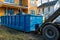 Recycling container trash dumpsters being full with garbage