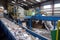 recycling facility, where different types of recyclables are being sorted and processed