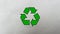 Recycling icon on a waste blank packaging paper