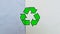 Recycling icon on waste packaging papers