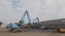 Recycling metal waste, metal recycling yard. Recycling of metal. Excavator with grab