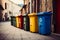 Recycling spectrum Bins in diverse hues line up against the wall