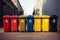 Recycling spectrum Bins in diverse hues line up against the wall