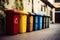 Recycling spectrum Bins in diverse hues line up against the wall