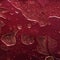 Red abstract background, liquids. Looks 3d. Strange texture with metallic sheen, bubbles and holes. Unusual oil and