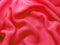 Red abstract background silk material waves