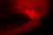 Red abstract glare on a black background