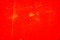 Red abstract scratched background. Vignette. Grunge texture.
