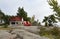 Red Adirondack chairs on a granite hill