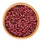 Red adzuki beans in wooden bowl over white